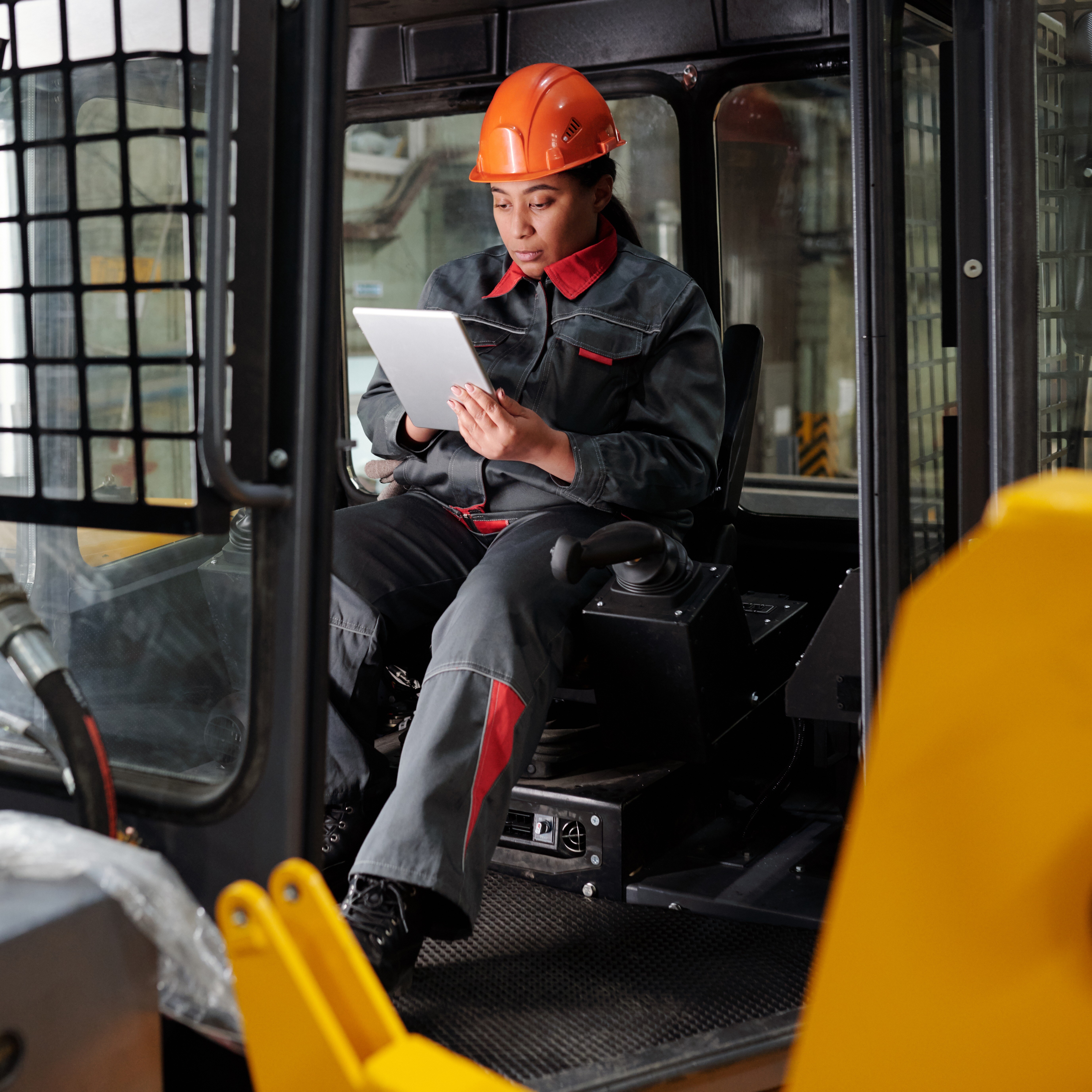 young-busy-worker-of-factory-scrolling-in-tablet-i-2022-03-09-22-19-59-utc